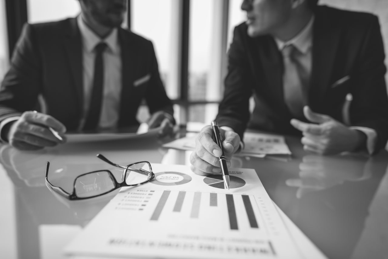 Board executives reviewing ESG compliance reports